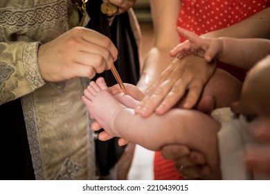 Orthodox Christian Priest During Baptism Ceremony