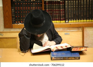 Orthodox Jew Studying Torah
. Special character of the Jewish rabbi, with a white beard and black hat