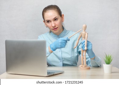 An Orthopedic Doctor Conducts Online Training On A Laptop. Close Up.