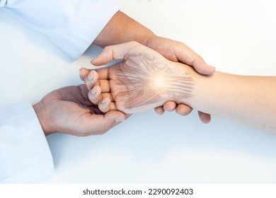 The orthopedic doctor or surgeon in uniform examined the patient with numbness of hand.Wrist pain in carpal tunnel syndrome with transparent anatomy of median nerve.Light effect on white background.