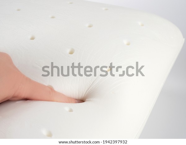 Orthopedic pillow, memory foam. Handprint on
the pillow. Comfortable bedding with orthopaedic, therapeutic
effect. Memory foam
material.
