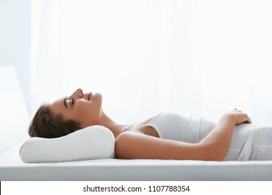 Orthopedic Pillow. Woman Lying In Bed