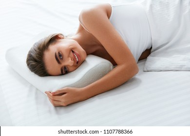 Orthopedic Pillow. Woman Lying In Bed