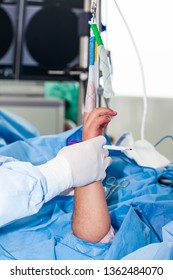 Orthopedic Surgeon Marking The Surgical Site Just Before Performing A Wrist Arthroscopy On A Male Patient