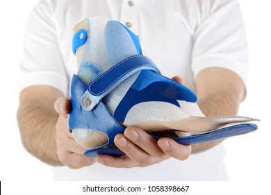 Orthopedist shows orthosis for foot deformity or walking disability