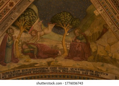 Orvieto, Italy - July 13, 2020: Fresco depicting the bible story of Elijah at Mount Horeb (Sinai) who flees into the desert and is fed by an angel, at the Chapel of the Corporal at Orvieto Cathedral
