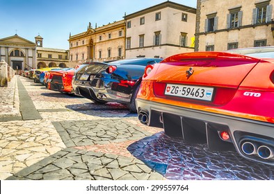 ORVIETO, ITALY - JUNE 28, 2015 - Hundreds of Ferrari supercars gathering in front of the Orvieto Cathedral on June 28, 2015, during the Ferrari Cavalcade 2015 event.