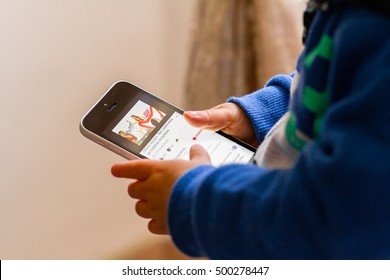 Orvieto, Italy - October 15th 2016:  Baby Watching A Video From Youtube On Apple Iphone. Close Up Of Hands