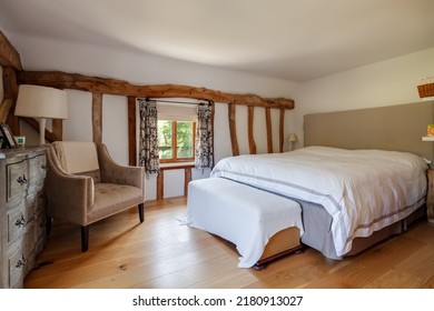 Orwell, Cambridgeshire - September 19 2019: Traditional Master Bedroom With Exposed Timbers And Floor