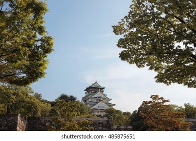 osaka castle between trees
