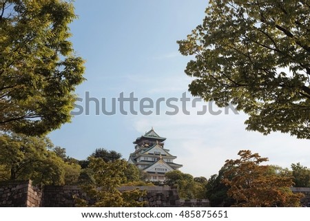 osaka castle between trees