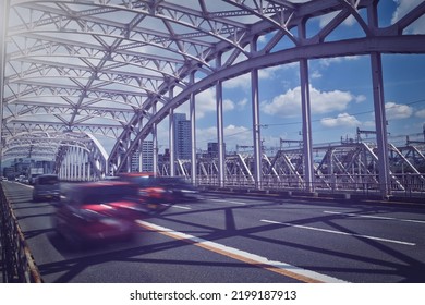 Osaka Cityscape With Bridges And Cars