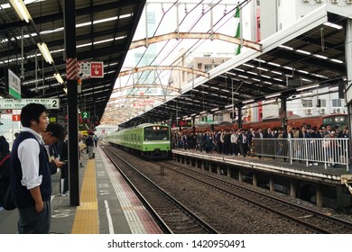 OSAKA, JAPAN - APR 14, 2016: Crowded And Busy Rail Platform, Passengers Waiting For Train At JR Shin-Imamiya Station. The JR Group Lies At The Heart Of Japan's Railway Network.