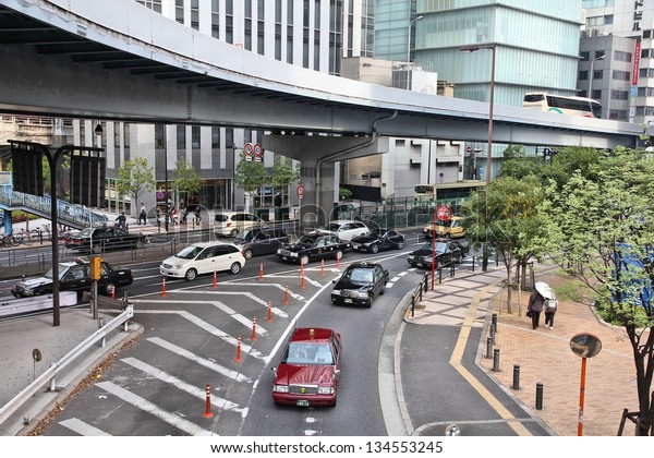 OSAKA, JAPAN - APRIL 25: Cars\
drive in heavy traffic on April 25, 2012 in Osaka, Japan. According\
to Tripadvisor, it is currently among best 3 shopping places in\
Osaka.