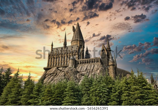 OSAKA, JAPAN - AUGUST 10, 2019: \
 Hogwarts Castle\
under dramatic sun set sky. The Wizarding World of Harry Potter in\
Universal Studios Japan (USJ). USJ is a fun and famous theme park\
in Osaka, Japan.