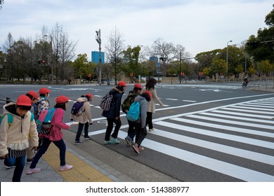 Osaka, Japan - February 22, 2016 : A Group Of School Kids With Their Teacher On A Field Trip To Osaka Castle, Osaka, Japan.