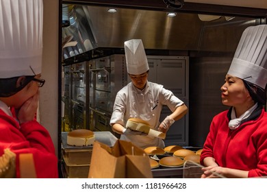 OSAKA, JAPAN - JAN 29, 2018: Pastry Chef Cooking The Famous Japanese Sponge Cake In Rikuro Ojisan Store