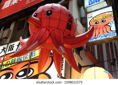 Osaka, Japan - January 5, 2018: A Giant Lantern In The Shape Of The Giant Red Octopus, The Symbol Of Takoyaki Store, Is One Of The Iconic Symbols Of The Store In Osaka, Japan.
