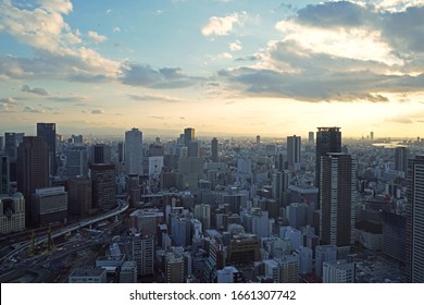 Osaka, Japan - January 9th, 2020: View of sunset in Osaka from Umeda Sky Building. Top view of vertical and dense city of Osaka. - Shutterstock ID 1661307742