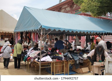 Osaka, Japan - June 22, 2018: Older Adults Are Choosing Second Hand Clothes At Shitennoji Flea Market