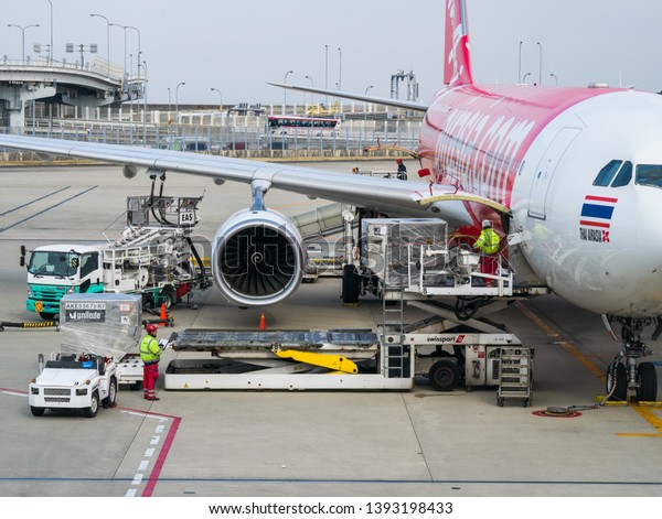 Osaka, Japan - March 14, 2019: Swissport\
International Ltd., the Swiss aviation service company providing\
airport ground and cargo handling agent services (container loading\
ramp and field\
operation)