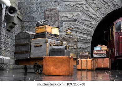 OSAKA, JAPAN - May 13, 2017 : Hogwarts Express Train, Universal Studio, Osaka, Japan. Old Vintage Movie Props, Luggage, Suitcase, Bird Cages At The Train Platform