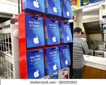 OSAKA, JAPAN - NOV 16, 2019: Apple Japan App Store & ITunes Credit Reload Card Selling In Convenient Store.