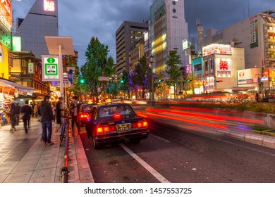 Osaka, Japan, November 13, 2018: Night View Of Dotonbori Shopping Street With People Getting Into A Taxi Car In Osaka, Japan