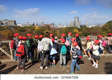 OSAKA, JAPAN - NOVEMBER 22, 2016: School Trip Visits Osaka Castle Park In Japan. Osaka Belongs To 2nd Largest Metropolitan Area Of Japan (19.3 Million People).