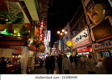 OSAKA -MARCH 23: Billbords at Dotonbori on March 23, Busy street of dotonbori with people walking at night. can be seen the running man billboard, a signature of dotonbori on March 23, 2014.