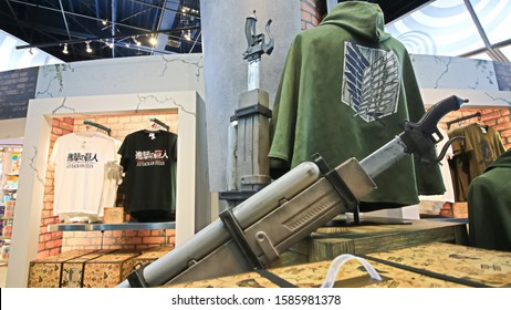 Osaka,Japan - July 11,2019 : Photo Of Mobile Device And T-shirt With Uniform Of The Outer Wall Survey Team For Souvenirs And 3D Mobile Gear Sword From Attack On Titan  At Universal Studios Japan.