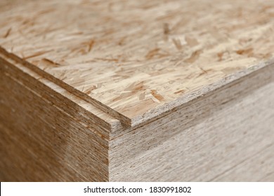 OSB. Finishing material of the molded chips. folded in a pile. - Shutterstock ID 1830991802