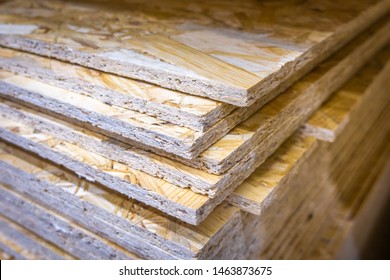 OSB sheets stacked in a hardware store. Construction material - Shutterstock ID 1463873675