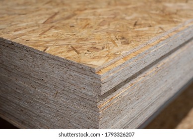 OSB sheets are stacked in a hardware store. Building material wood - Shutterstock ID 1793326207