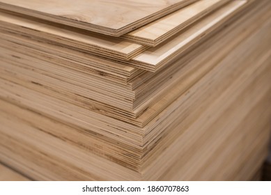 OSB sheets are stacked in a hardware store. The building material is wood. - Shutterstock ID 1860707863