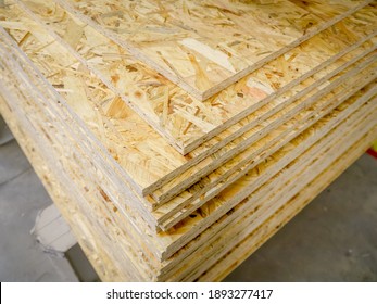 OSB sheets stacked in a hardware store. Construction material - Shutterstock ID 1893277417