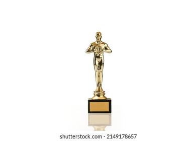 Oscar Award Or Hollywood Golden Trophy Isolated. The Concept Of Success And Victory.