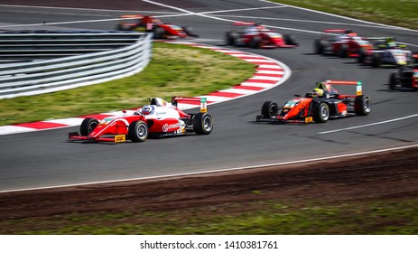 Oschersleben, Germany, April 28, 2019: Male Driver Paul Aron Driving A Red Prema Theodore Racing During Adac Formula 4 At The Motorsport Arena Oschersleben.