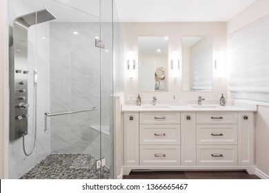 Oshawa, Ontario / Canada - March 5, 2019: A Clean, Bright And Spacious Custom Designed Bathroom In Oshawa, With Overhead Shower Panel And Double Sink Vanity Table.