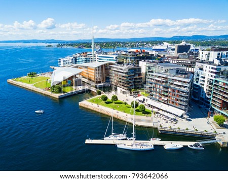 Oslo harbor or harbour at the Aker Brygge neighbourhood in Oslo. Oslo is the capital of Norway.