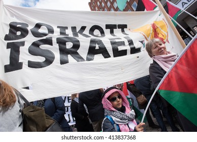 OSLO - MAY 1: Solidarity activists carry  banners calling for a boycott of Israel during the May Day parade in Oslo, Norway, May 1, 2016.