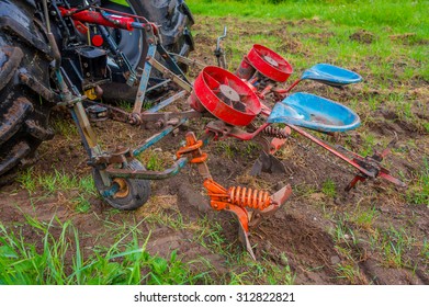 OSLO, NORWAY - 8 JULY, 2015: Two Seated Potato Machine Used For Planting Hooked To Tractor.