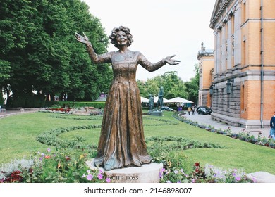 Oslo, Norway - August 2, 2019:  The statue of Wenche Foss outside National Theater on Karl Johans gate street