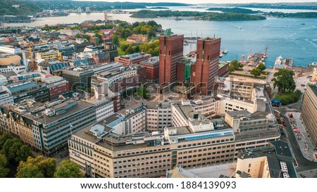 Oslo, Norway. Beautiful panoramic aerial view photo from flying drone to Oslo City Hall is a municipal building in Oslo, the capital of Norway. Against the background of port yachts.