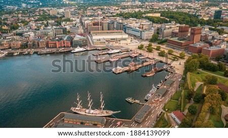 Oslo, Norway. Beautiful panoramic aerial view photo from flying drone to Oslo City Hall is a municipal building in Oslo, the capital of Norway. Against the background of port yachts.