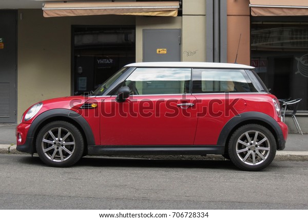 OSLO, NORWAY - CIRCA AUGUST 2017: red Mini\
Cooper car (2013 model) with white\
roof