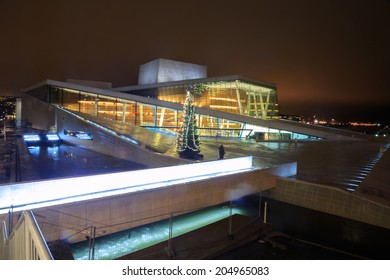 OSLO, NORWAY - DEC 31: National Oslo Opera House shines at sunrise on December 31, 2012. Oslo Opera House was opened on April 12, 2008 in Oslo, Norway