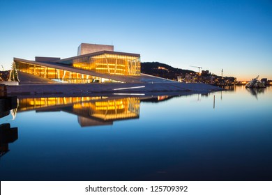 OSLO, NORWAY - JANUARY 1: National Oslo Opera House shines at sunrise on January 1, 2013. Oslo Opera House was opened on April 12, 2008 in Oslo, Norway