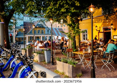 Oslo, Norway -  July 15 2021: City Scape View With People Relax At Coffee Shop Terrace Outdoor.