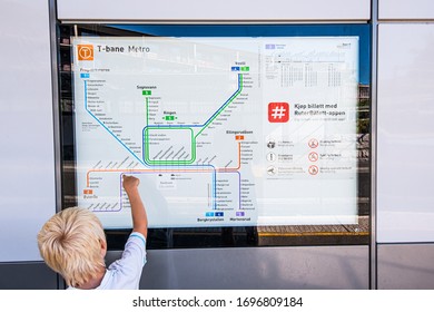 Oslo, Norway - July 20 2016: Kid Pointing At A Map Of The Subway System Of Oslo.